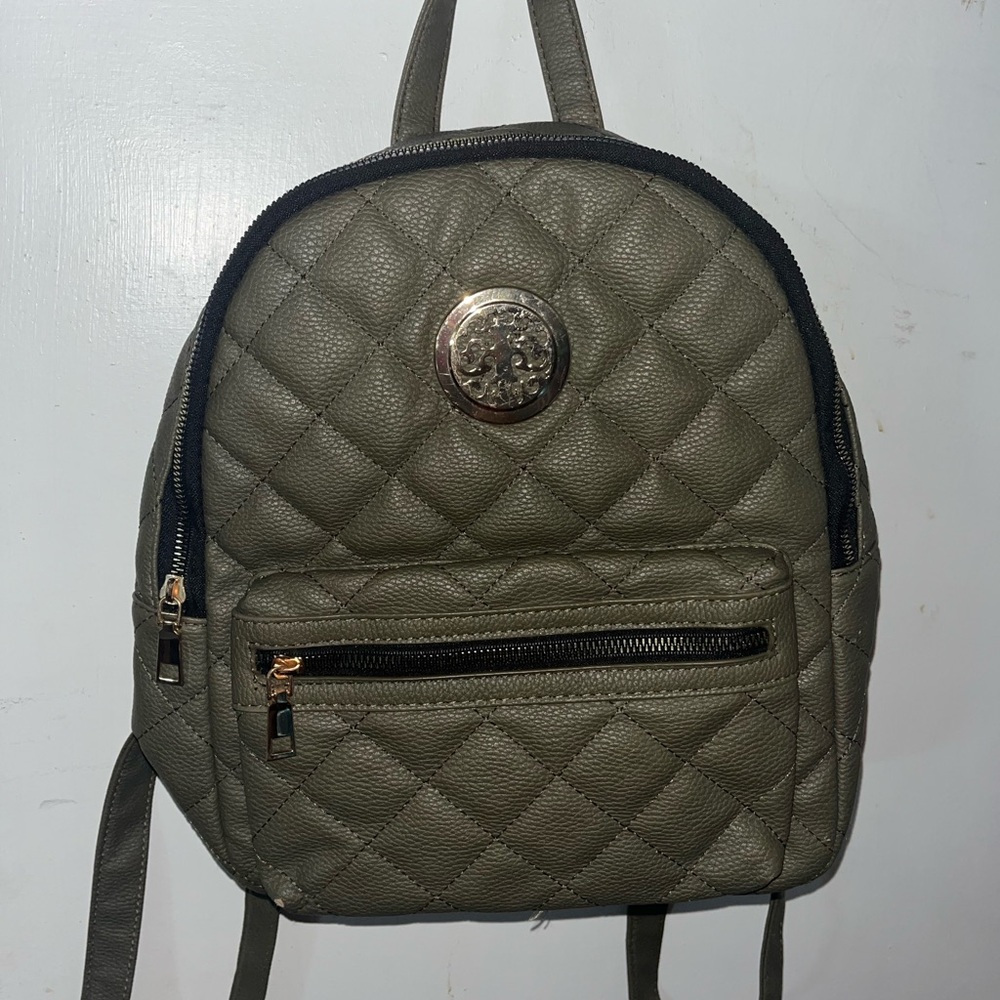 Green Quilted Backpack with Circular Emblem